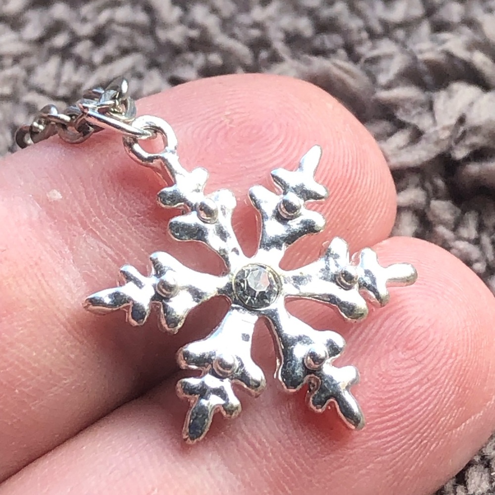 Shiny silver snowflake pendant on chain necklace